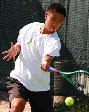 Augustus hitting a tennis ball