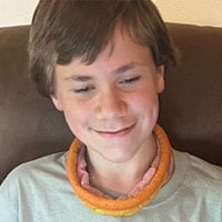 Student looking for college and career partnerships on their laptop